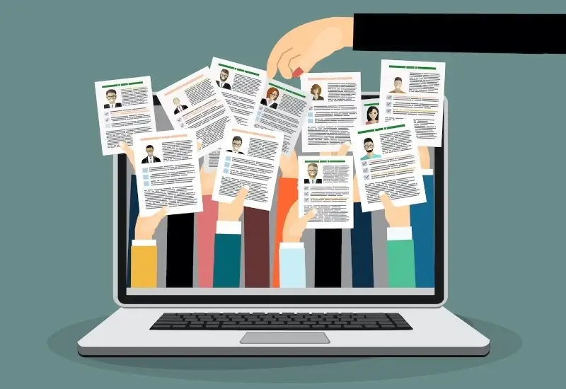 Graphic of a computer with papers all over the screen and a hand picking one