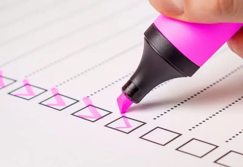 A pink highlighter checking off a list